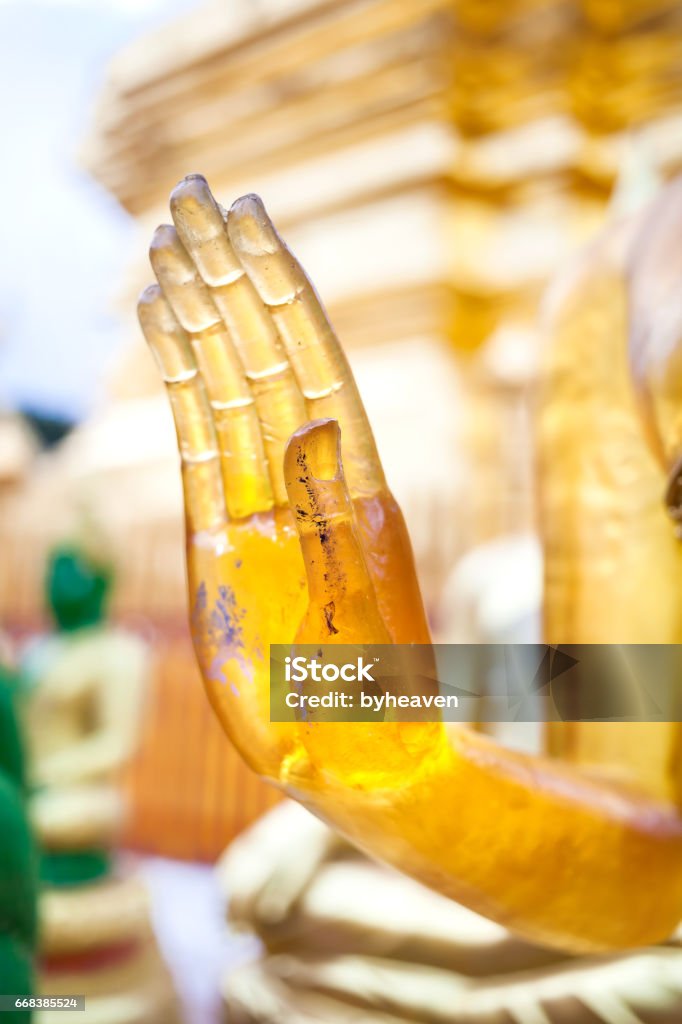 Buddha hand in Thailand Hand of Buddha in mudra from yellow stone in Wat Doi Suthep, Ciang Mai, Thailand Arts Culture and Entertainment Stock Photo