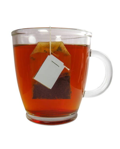 istock Glass teacup with teabag 668385894