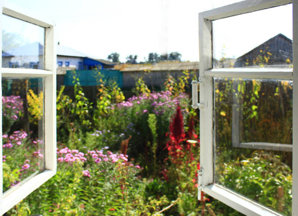 opened window to the summer garden in the village