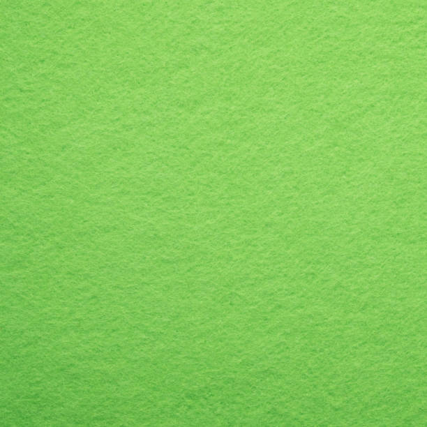 istock Abstract bright green felt cloth as background and square 668389254