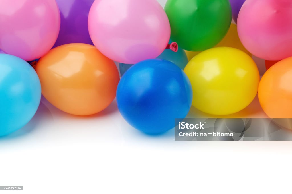colored balloons on white background multi colored birthday balloons on white background Backgrounds Stock Photo