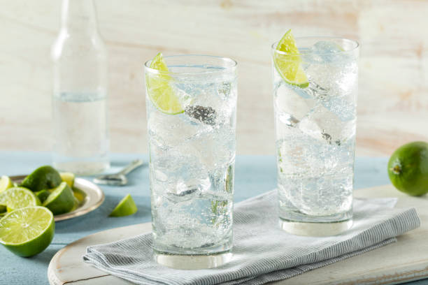 Refreshing Hard Sparkling Water Refreshing Hard Sparkling Water with a Lime Garnish vodka photos stock pictures, royalty-free photos & images