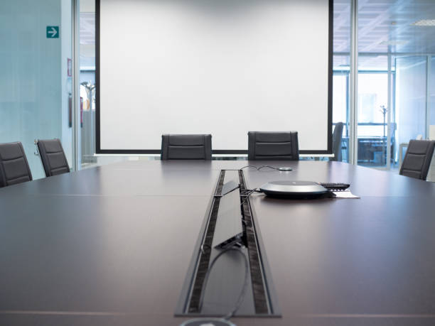istock wheelchairs in a conference room 668395982