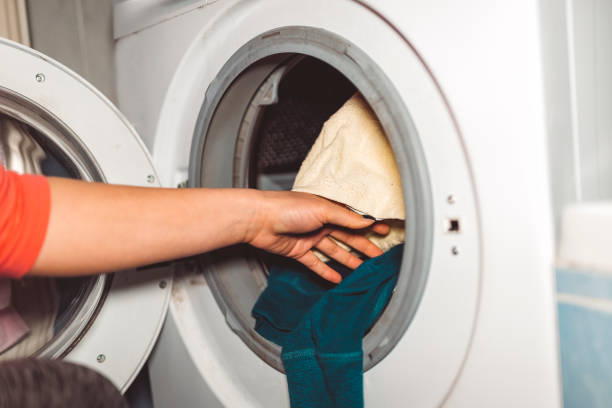istock Young woman putting a wash on 668396206