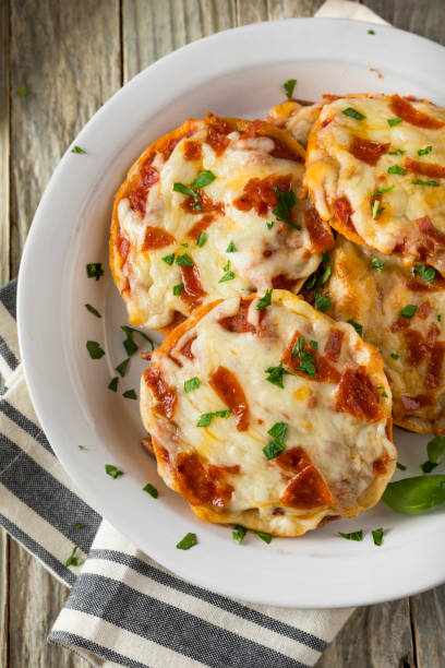 istock Homemade Pepperoni Mini Pizza Bagels 668409110