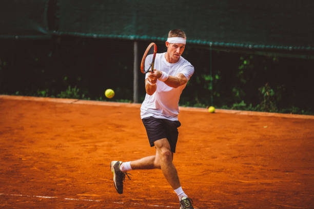 istock Tennis player chasing the ball 668409492