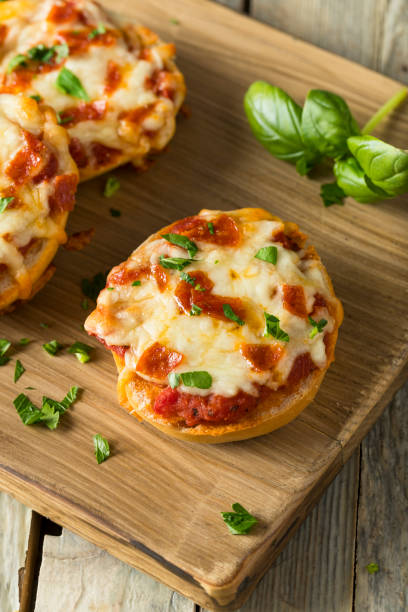 istock Homemade Pepperoni Mini Pizza Bagels 668409728