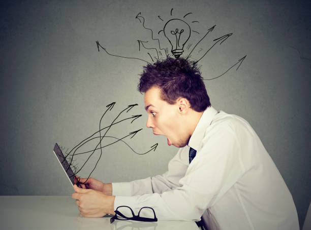 istock Shocked young man working on laptop 668410166