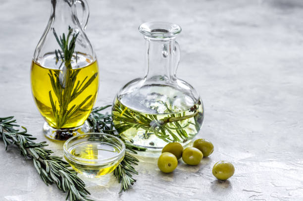 istock jar with oil with olives on stone table background mockup 668412558