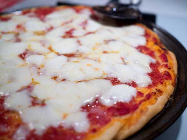 Italian pizza close up with cheese and tomato
