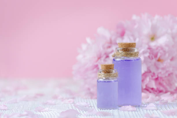 istock wellness, spa and aromatherapy with essential oils, fresh plants on pink background, selective focus 668415508