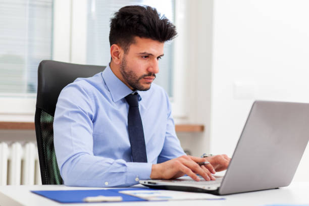 istock Businessman at work in his office 668416628
