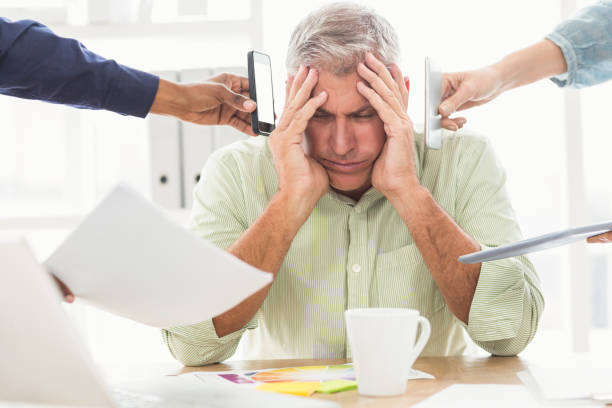 istock Overwrought businessman with hands on head 668420002