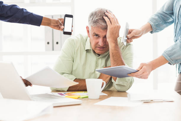 istock Overwrought businessman with hands on head 668422174