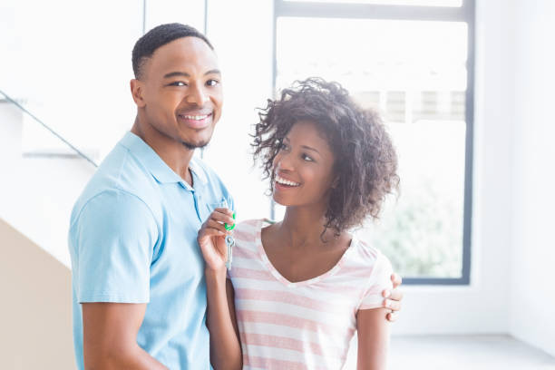 istock Young couple showing their house key 668422238