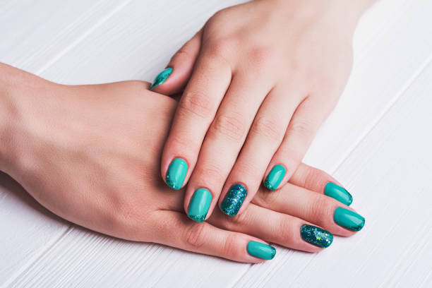 Turquoise nail art with tinsels