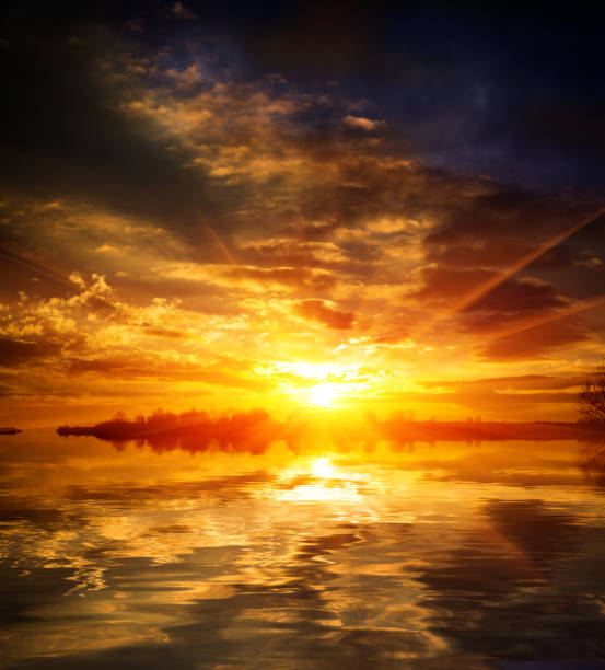 istock nice red sunset over lake water 668423060