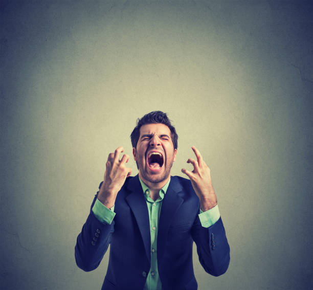 istock portrait of young angry man 668426774