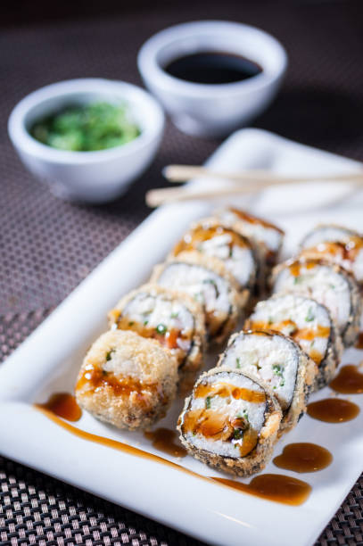 istock Deep fried sushi with eel and philadelphia cheese 668429494
