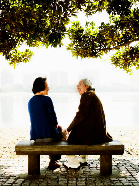 istock Older Couple on a Park Bench 668449540