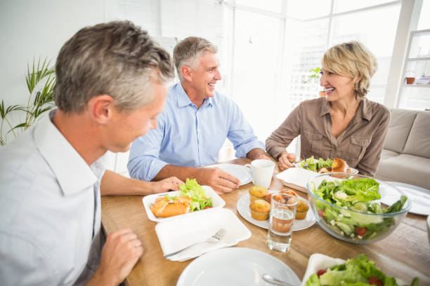 istock Smiling business people having lunch together 668450118