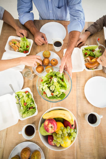 istock Business people having lunch together 668450144