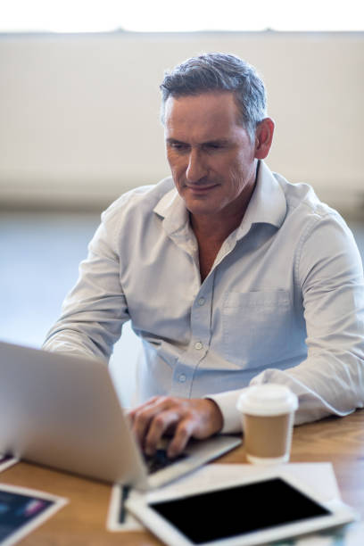istock Businessman working at his desk 668450962