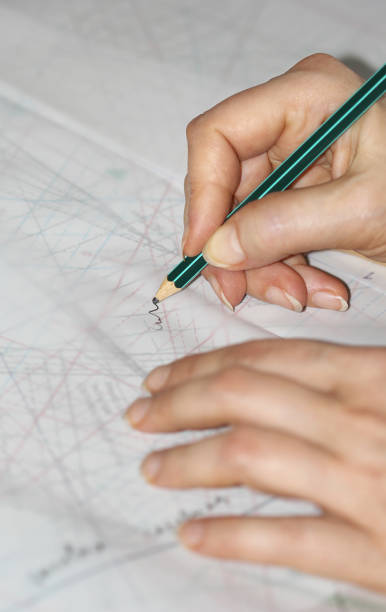 istock The woman hands tracing the sewing drawing 668453252