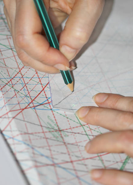 istock The woman hands tracing the sewing drawing 668453254
