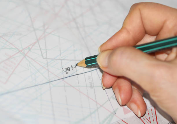 istock The woman hands tracing the sewing drawing 668453258