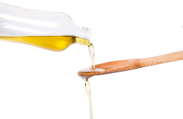 istock Olive oil is flowing from the spit to the spoon 668459802