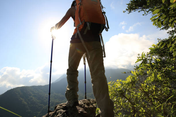 istock successful young woman hiker hiking on mountain peak 668466138