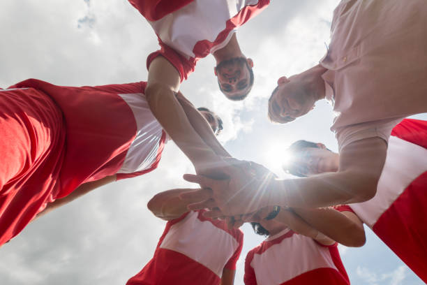 istock Soccer team with hands together 668472374