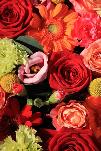 istock orange and red wedding flowers 668474768