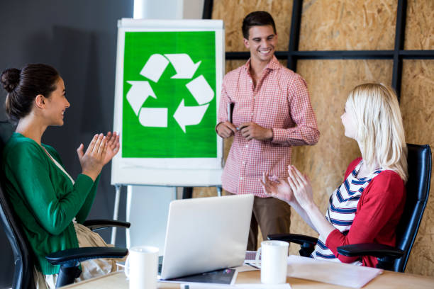 istock Team applauding a colleague after presentation 668480408