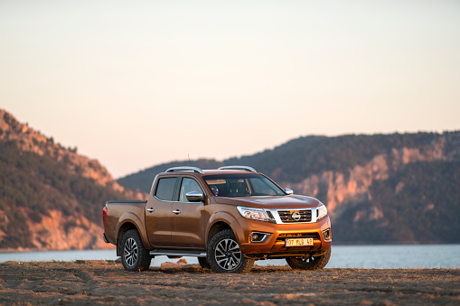 Nissan NP300 Navara stopped on the beach near Dalaman, Turkey. The newest generation of Navara was debut in 2015 on the market. The Navara is powered by 2,3-litre diesel engine and 190 HP