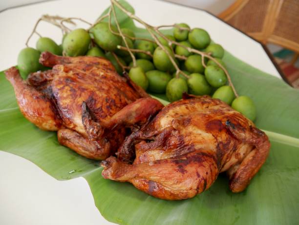istock Roasted chicken (lechon manok) and green mangoes 668493960