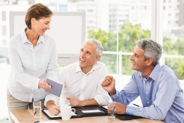 istock Smiling business people making an arrangement 668502862