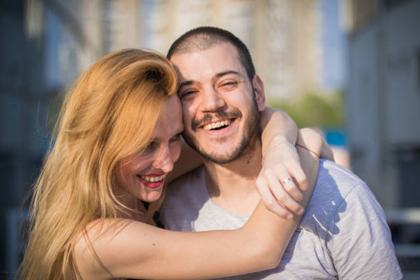 istock Beautiful young couple hugging on a lovely summer day 668503706