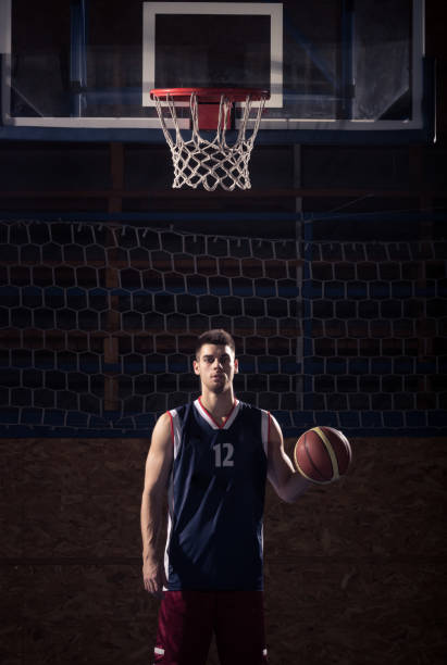 istock basketball player, ball indoors rim net 668506618