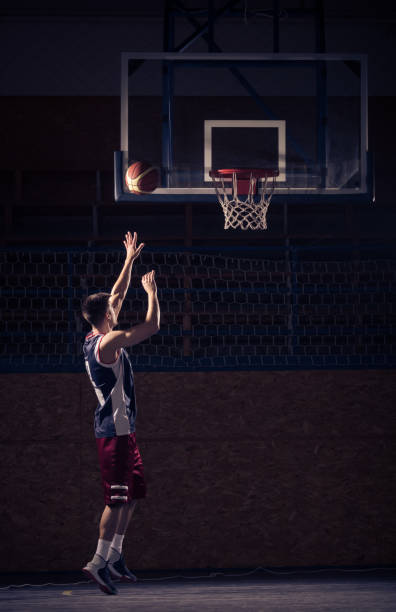 istock Basketball player shooting, indoors court 668507022
