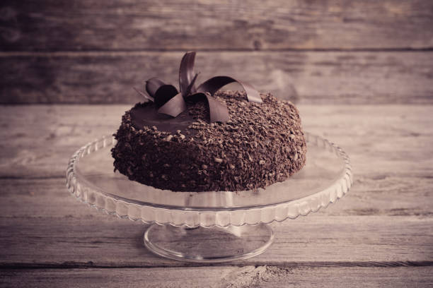istock Chocolate cake on old wooden table 668510008