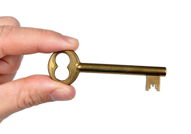 istock Hand holding golden door key. 668513026