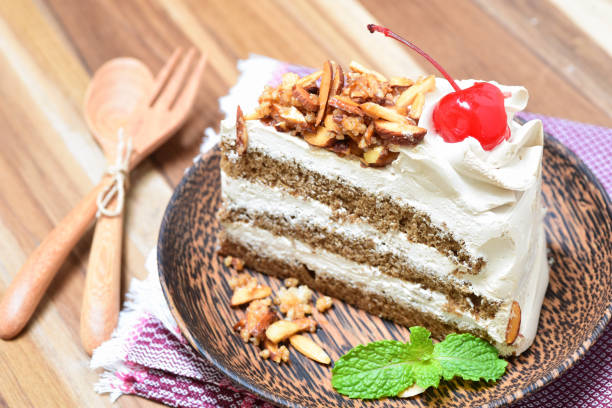 slice of genoise coffee cake on wooden plate