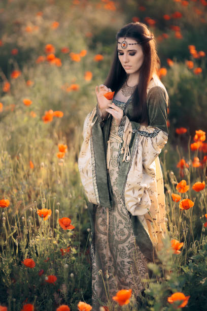 istock Princess Pulling Petals from a Poppy Flower for Love Superstation 668515550