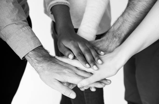istock Pile of hands unity teamwork diverse people 668519280