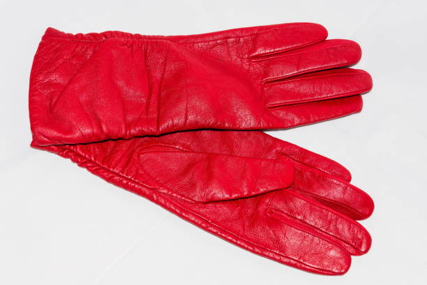 istock Female red leather gloves close-up on a white background 668522906