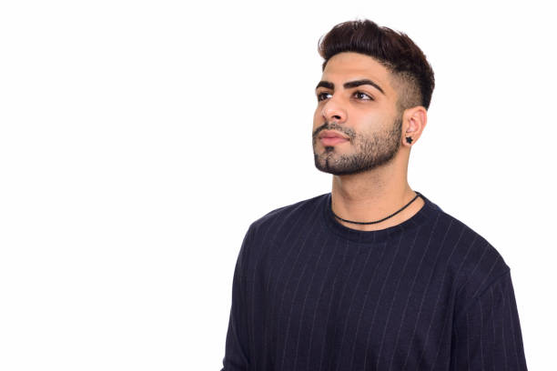 istock Close up of young handsome Indian man thinking while looking up 668526432