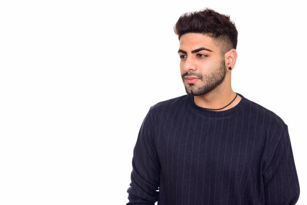 istock Close up of young handsome Indian man thinking while looking down 668526458