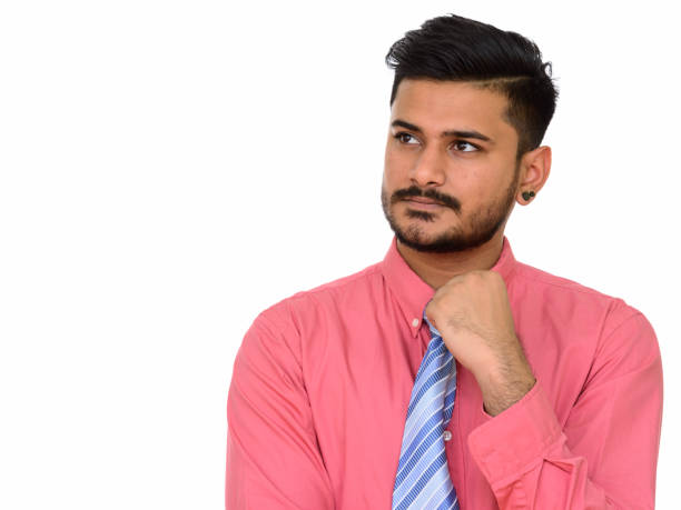 istock Young handsome Indian businessman thinking 668538092